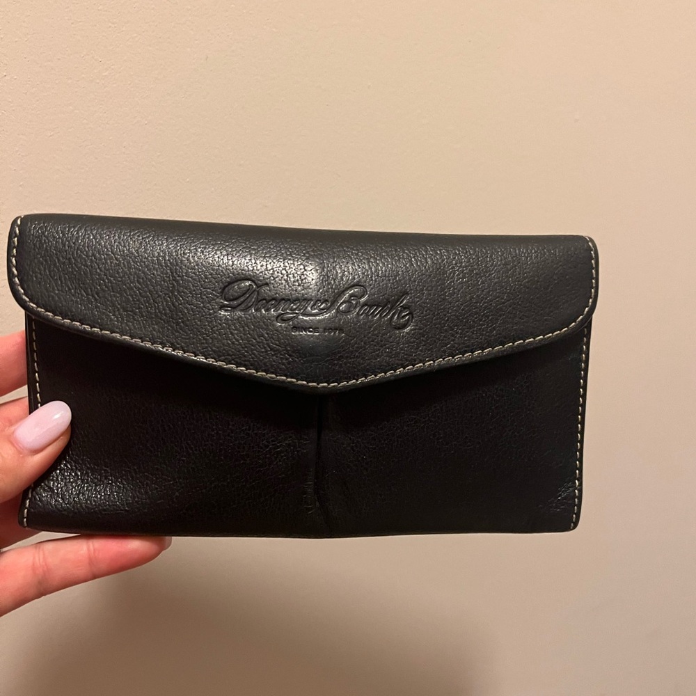 Barely used, Dooney and Bourke black leather wallet.